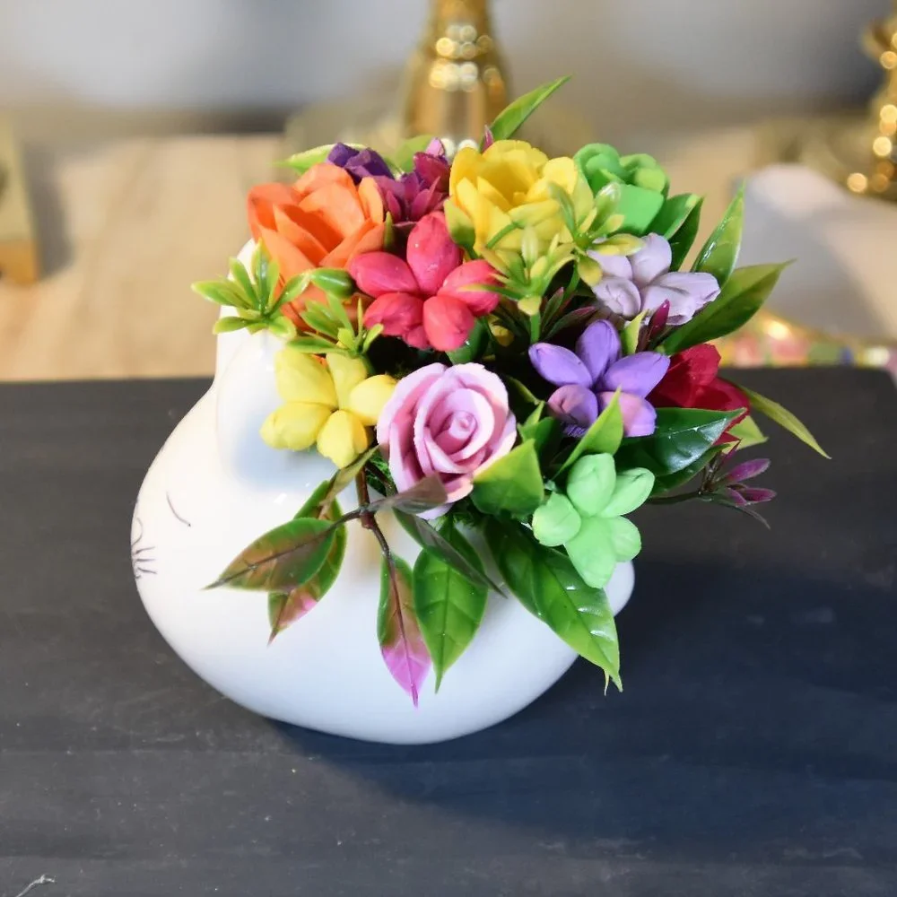 Cute small bunny rabbit planter filled small Sola flowers dyed in bright colors
